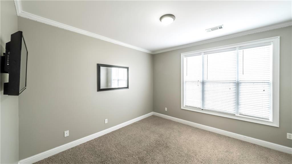 896 Winn Road Douglasville, GA 30134 - Photo 32 of 64 an empty room with windows