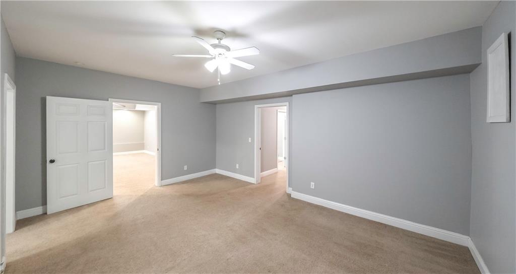 896 Winn Road Douglasville, GA 30134 - Photo 40 of 64 a view of an empty room with a chandelier fan