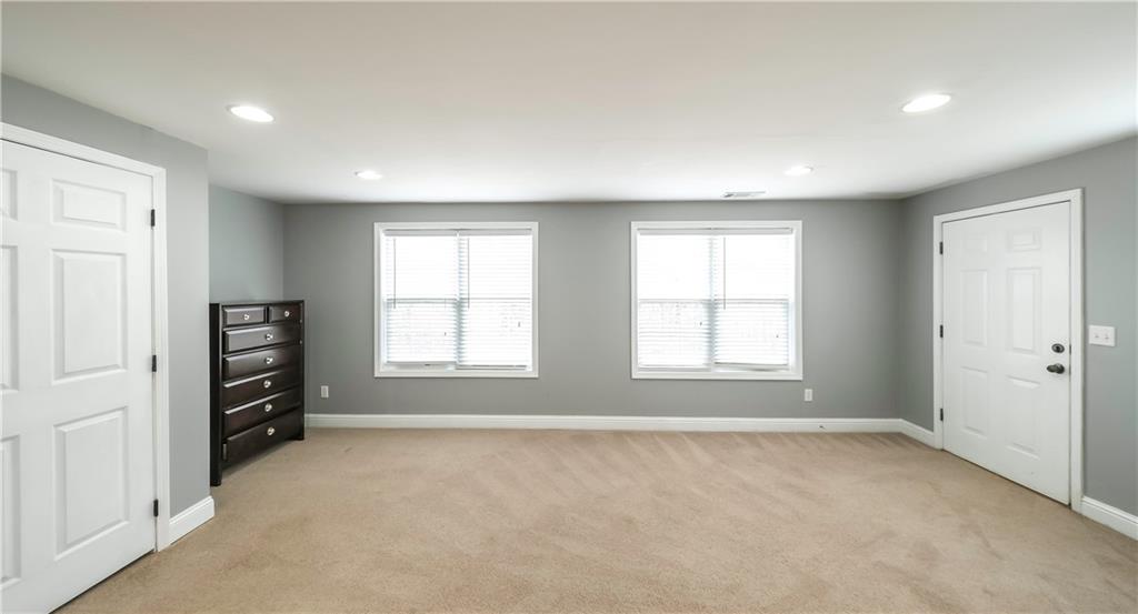 896 Winn Road Douglasville, GA 30134 - Photo 46 of 64 an empty room with windows and closet
