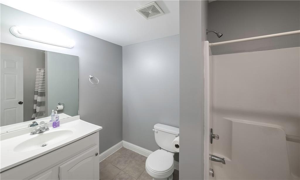 896 Winn Road Douglasville, GA 30134 - Photo 48 of 64 a bathroom with a sink a toilet and shower