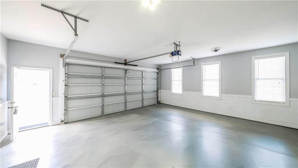 896 Winn Road Douglasville, GA 30134 - Photo 50 of 64 en empty room with windows and ceiling fan