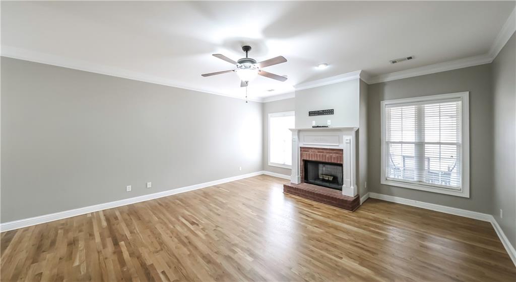 896 Winn Road Douglasville, GA 30134 - Photo 5 of 64 an empty room with windows a fireplace