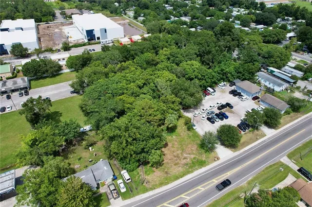 an aerial view of residential house with outdoor space and street view