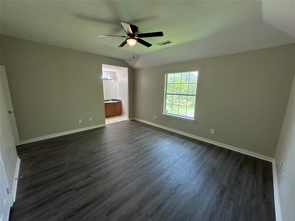 1160 South Beltline Road Dallas, TX 75253 - Photo 13 of 18 a view of an empty room with wooden floor and a window