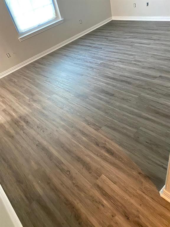 1160 South Beltline Road Dallas, TX 75253 - Photo 17 of 18 a view of a room with wooden floor