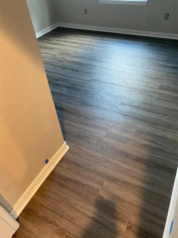 1160 South Beltline Road Dallas, TX 75253 - Photo 18 of 18 a view of an empty room with wooden floor