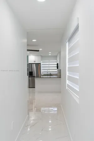 a view of room with window and stairs