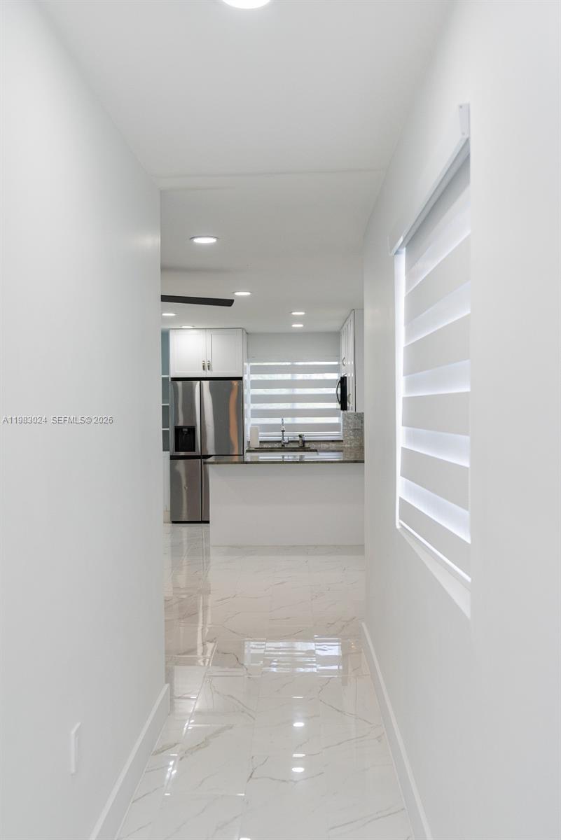 13270 Southwest 103rd Terrace, Unit 2 Miami, FL 33186 - Photo 22 of 41 a view of kitchen with refrigerator and window