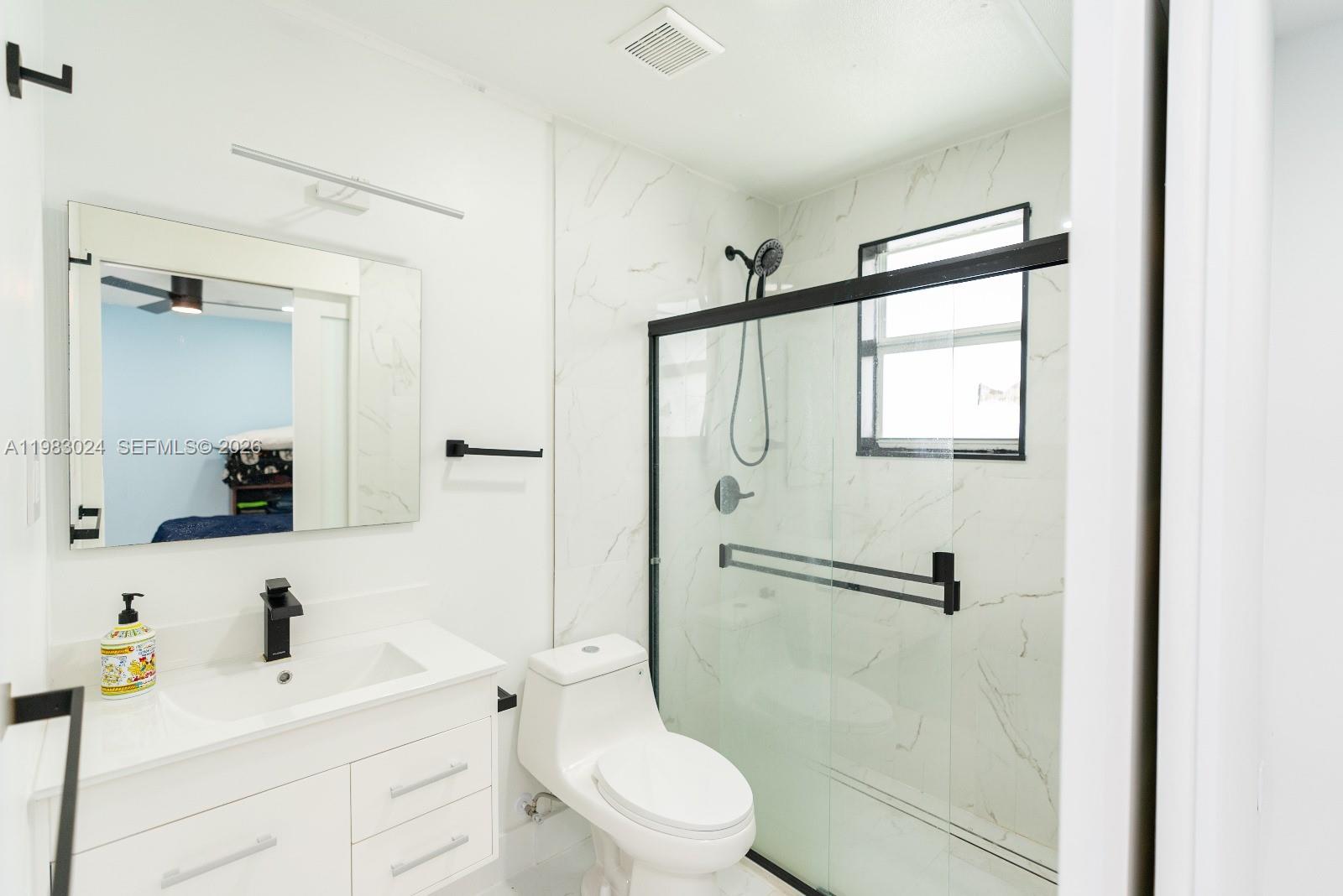 13270 Southwest 103rd Terrace, Unit 2 Miami, FL 33186 - Photo 27 of 41 a bathroom with a sink toilet tub and shower