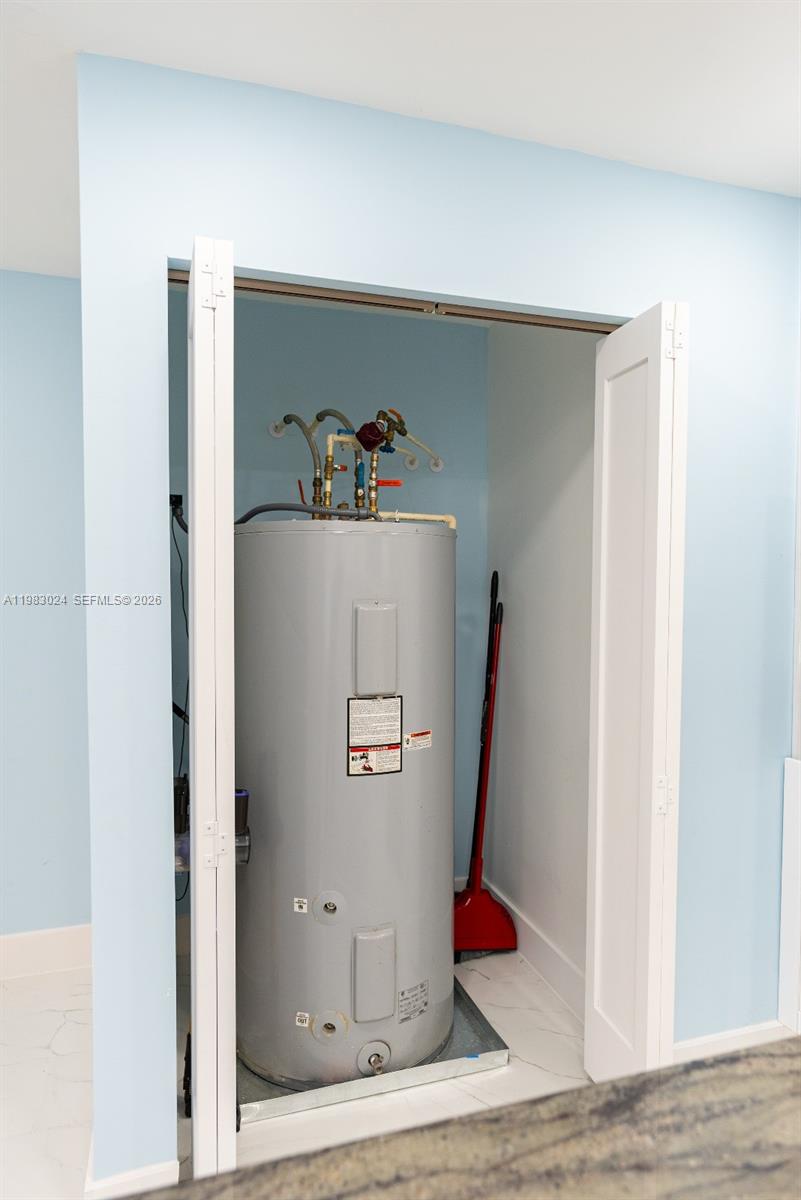 13270 Southwest 103rd Terrace, Unit 2 Miami, FL 33186 - Photo 32 of 41 a white refrigerator freezer sitting inside of a kitchen