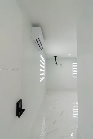 a bedroom with a bed and a ceiling fan