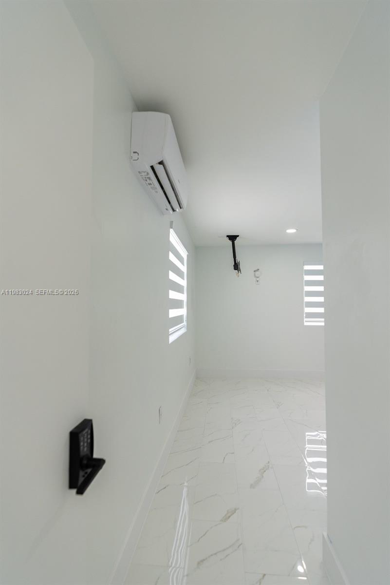 13270 Southwest 103rd Terrace, Unit 2 Miami, FL 33186 - Photo 33 of 41 an empty room with windows