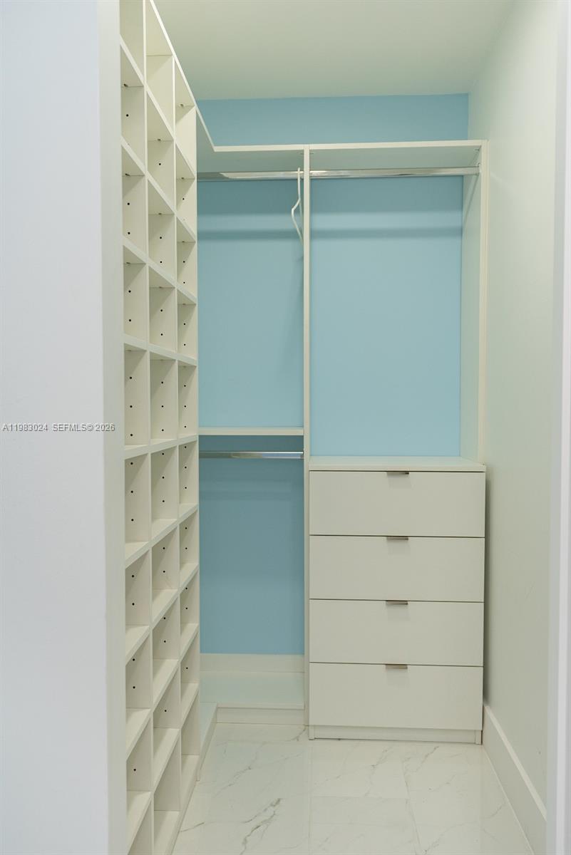 13270 Southwest 103rd Terrace, Unit 2 Miami, FL 33186 - Photo 40 of 41 a view of an empty walk in closet