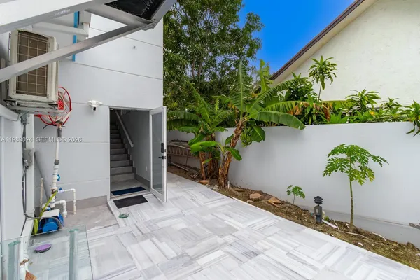 a backyard of a house with lots of green space