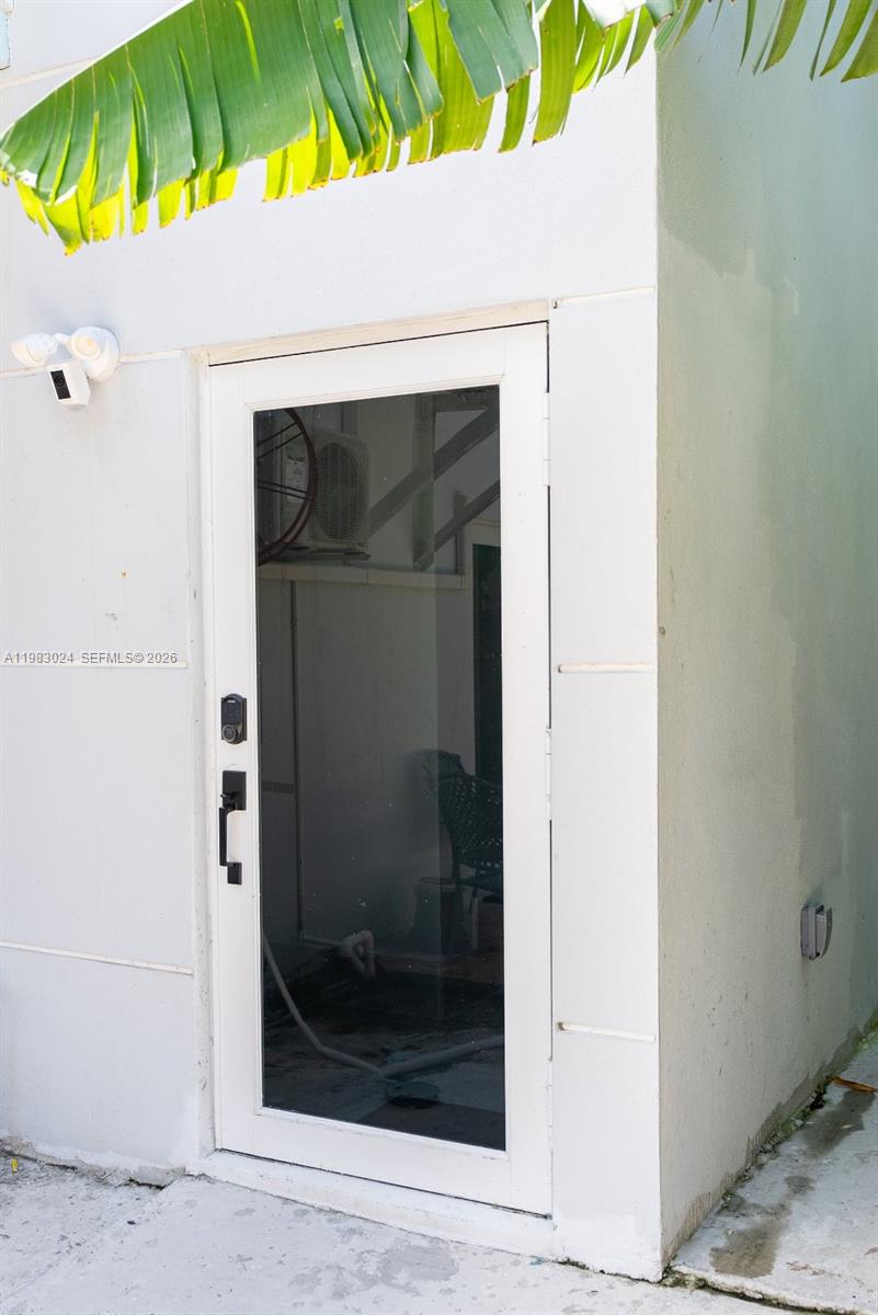 13270 Southwest 103rd Terrace, Unit 2 Miami, FL 33186 - Photo 6 of 41 a view of a wooden door