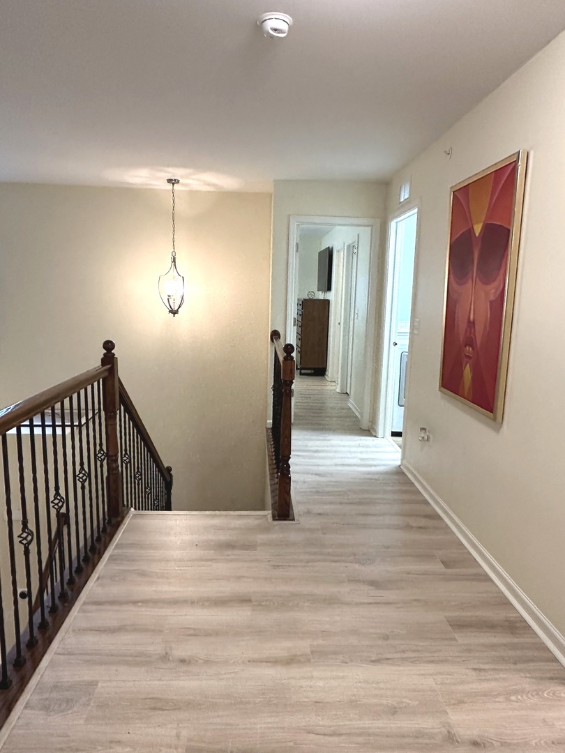 5102 Monroe Street Matteson, IL 60443 - Photo 29 of 54 a view of a room with wooden floor and stairs