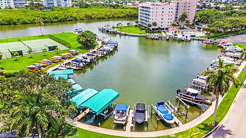 5 Bluebill Avenue, Unit 209 Naples, FL 34108 - Photo 26 of 32 an aerial view of a house with a lake view