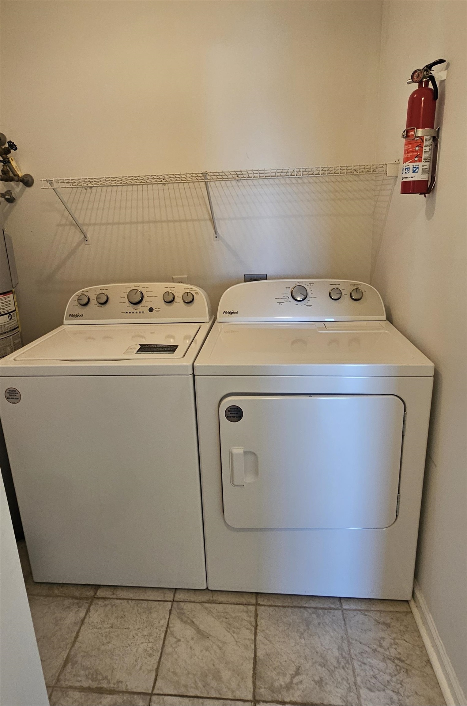 2273 Huntingdon Drive, Unit J Myrtle Beach, SC 29575 - Photo 11 of 24 Laundry room with washing machine and dryer and strapped water heater
