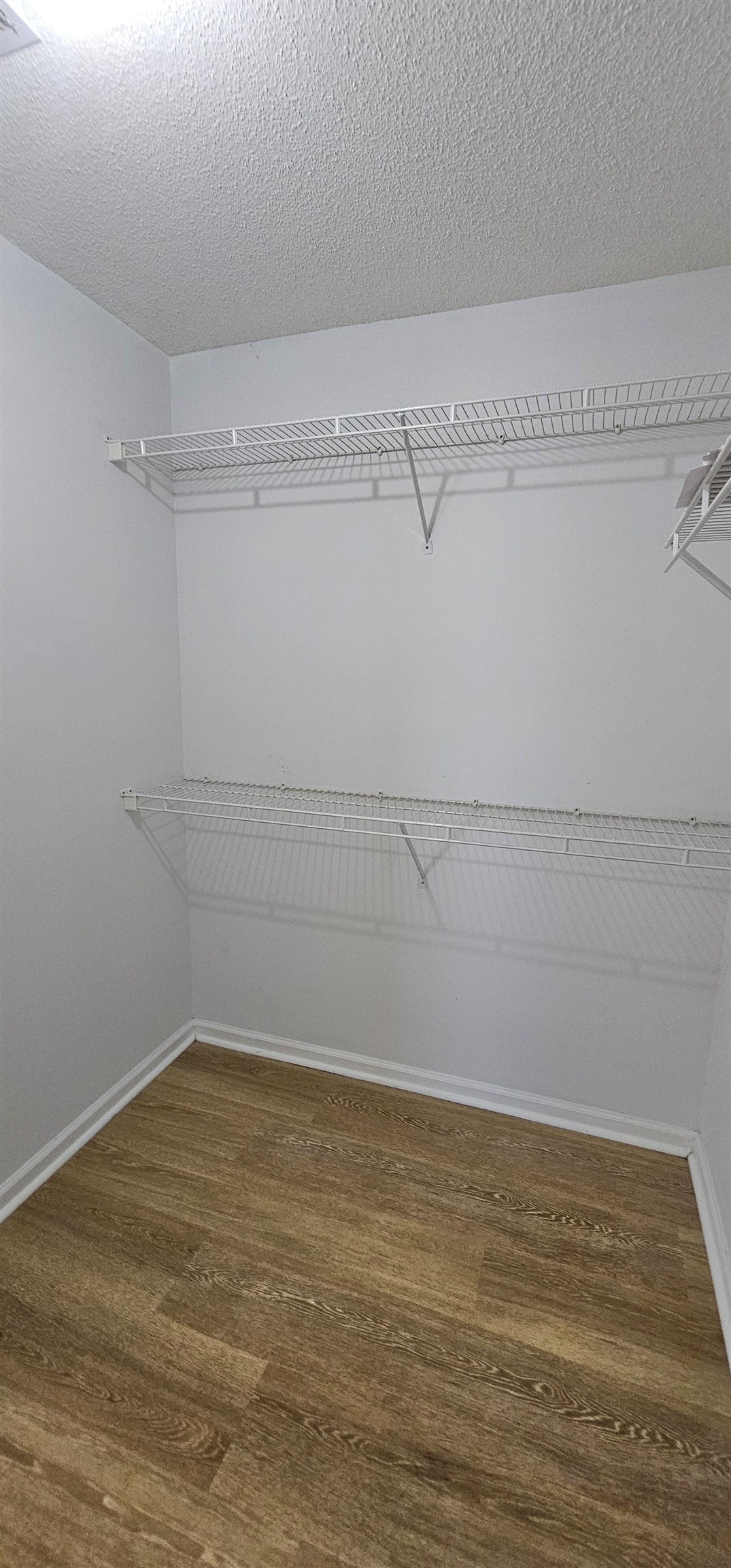 2273 Huntingdon Drive, Unit J Myrtle Beach, SC 29575 - Photo 16 of 24 Spacious closet featuring dark wood finished floors