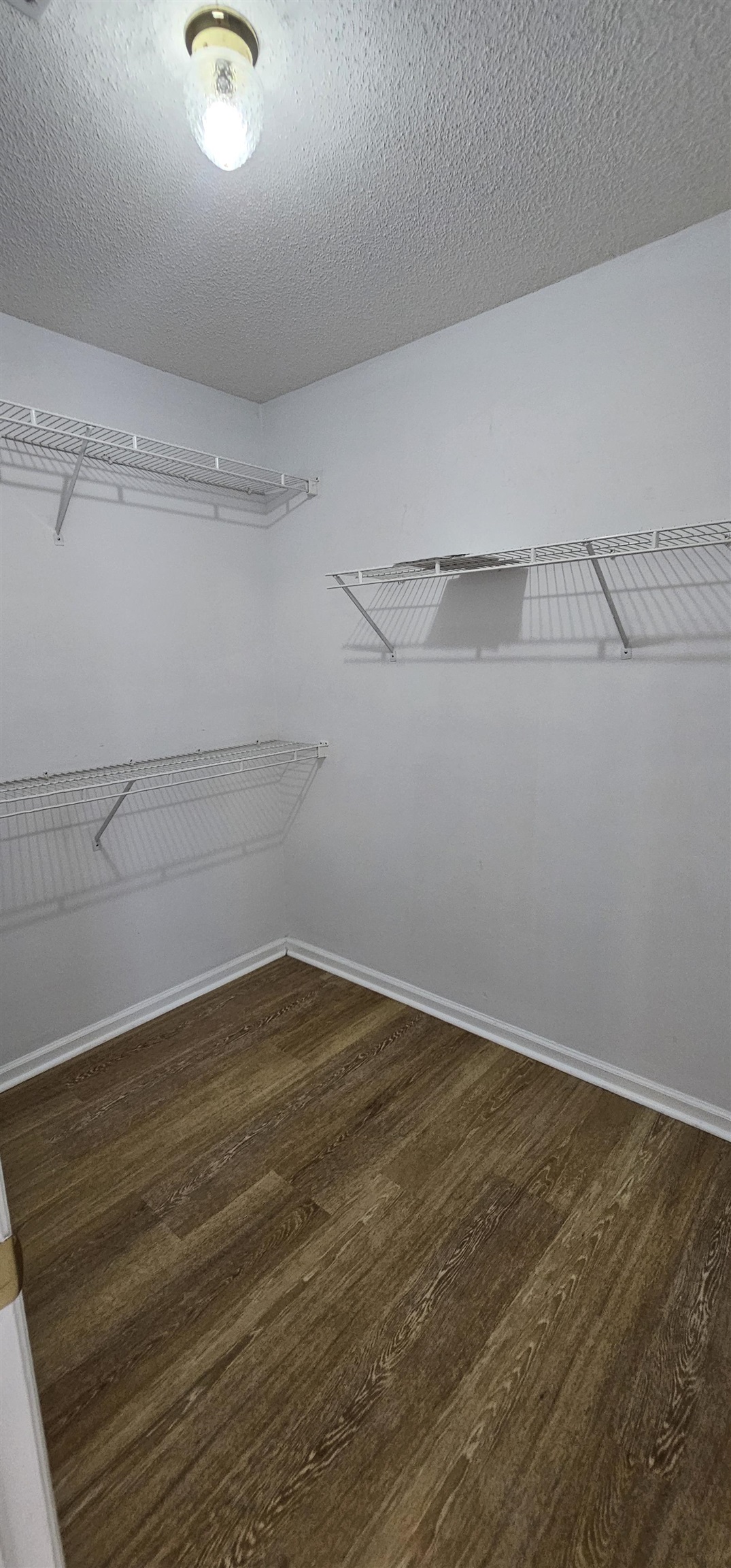 2273 Huntingdon Drive, Unit J Myrtle Beach, SC 29575 - Photo 17 of 24 Spacious closet featuring dark wood-style floors