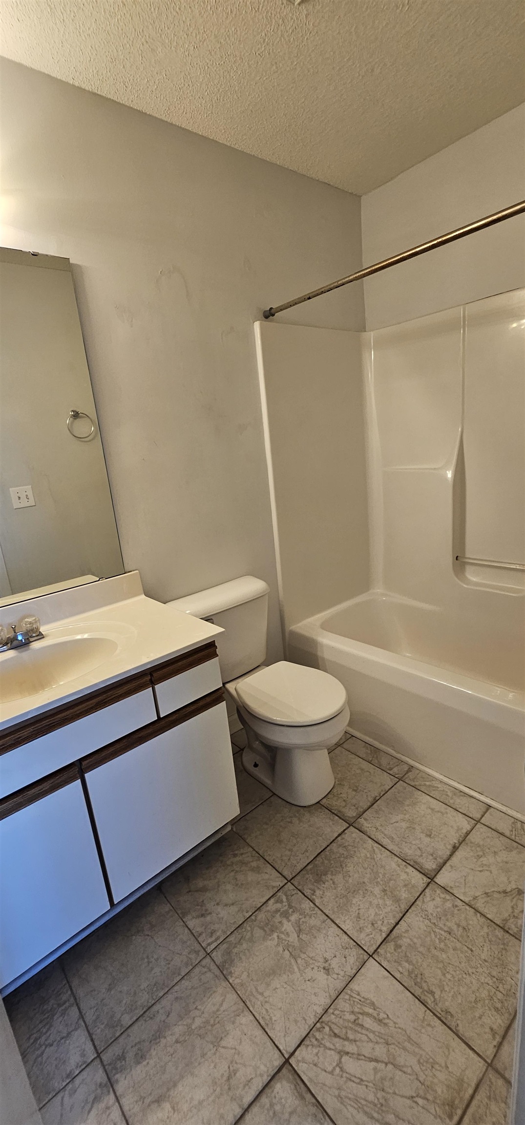 2273 Huntingdon Drive, Unit J Myrtle Beach, SC 29575 - Photo 18 of 24 Full bathroom with vanity, a textured ceiling, and shower / bathtub combination