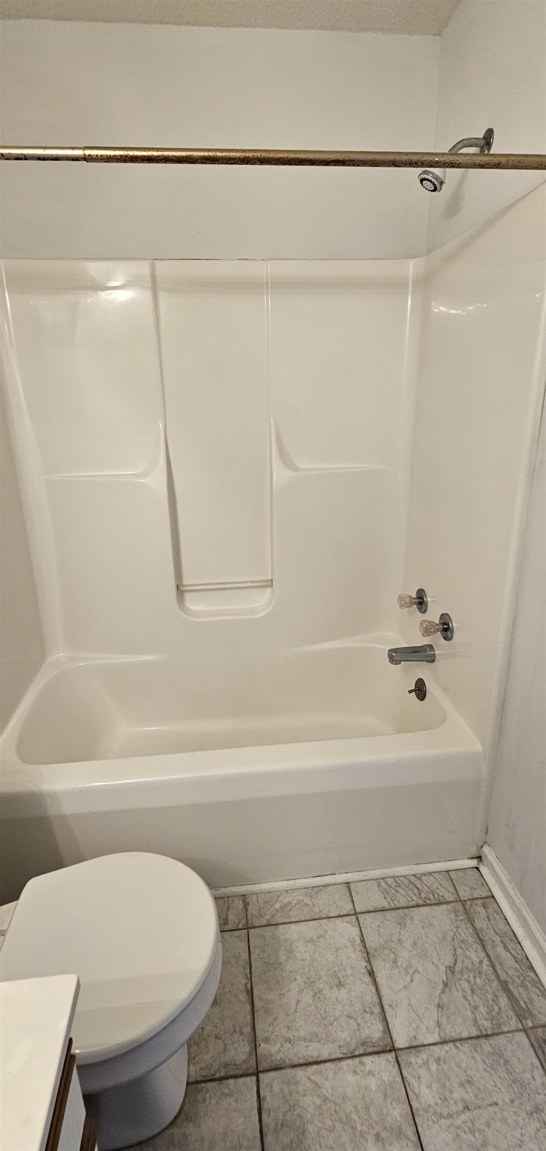 2273 Huntingdon Drive, Unit J Myrtle Beach, SC 29575 - Photo 21 of 24 Bathroom with washtub / shower combination, vanity, a textured ceiling, and light tile patterned floors
