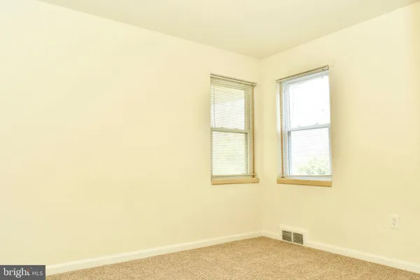 a view of a room that has a window in it