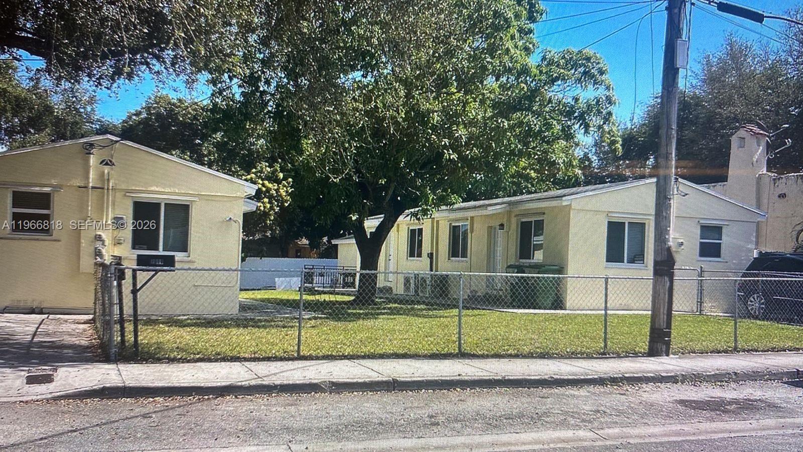 7637 Northwest 3rd Avenue, Unit 1 Miami, FL 33150 - Photo 1 of 20 a front view of a house with a yard