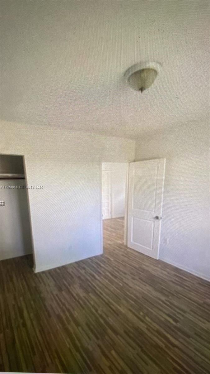 7637 Northwest 3rd Avenue, Unit 1 Miami, FL 33150 - Photo 6 of 20 a view of empty room with wooden floor