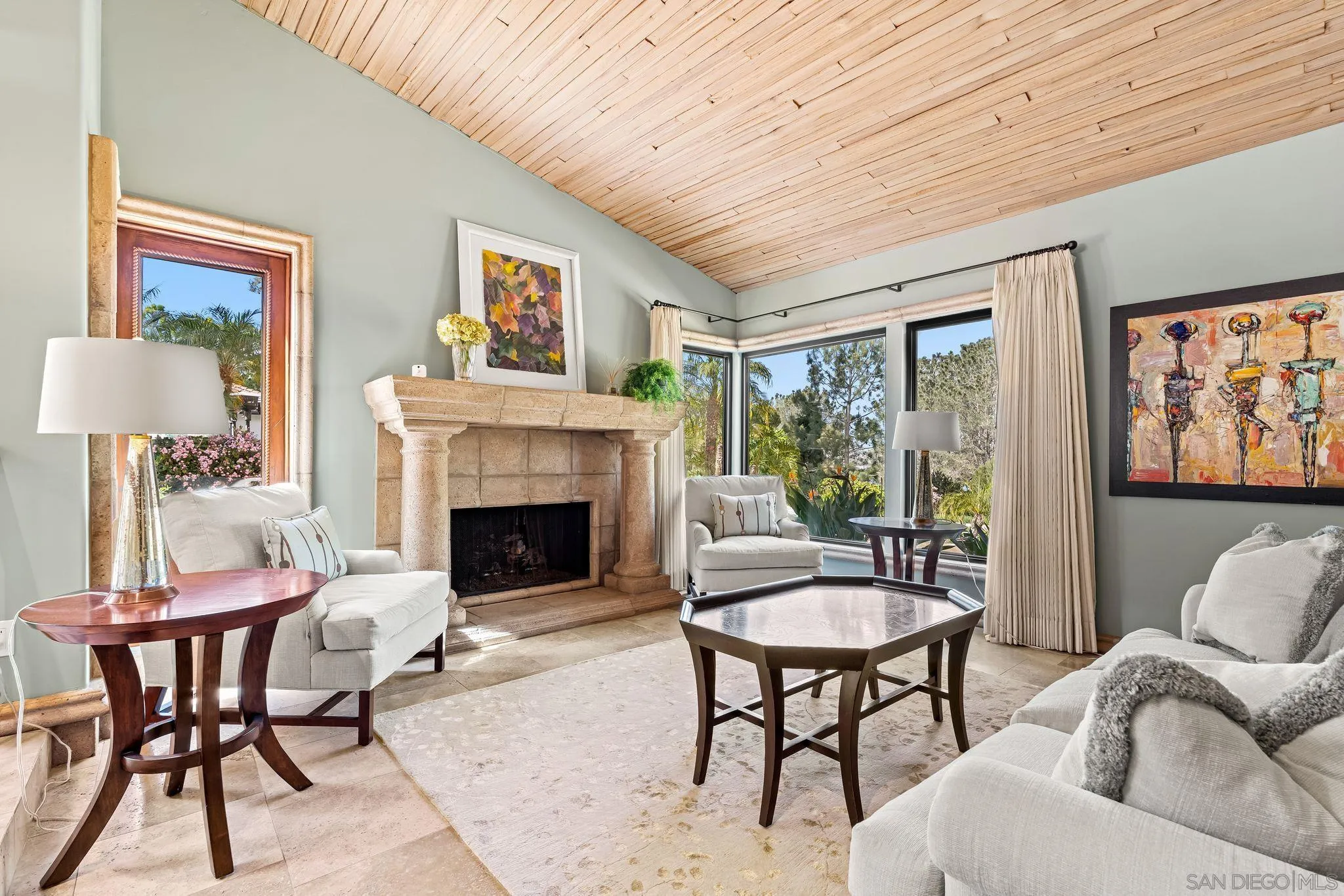 2969 Racetrack View Drive Del Mar, CA 92014 - Photo 8 of 59 a living room with furniture a table and a fireplace