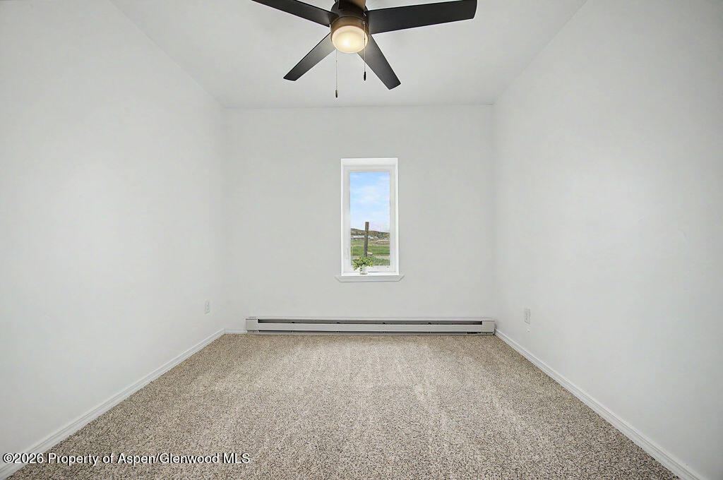 54 South Ranney Street Craig, CO 81625 - Photo 13 of 32 an empty room with a window