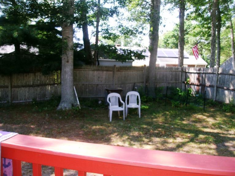 27 Harbor Hills Road Centerville, MA 02632 - Photo 5 of 14 a backyard of a house with yard fountain and outdoor seating