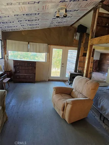 a living room with furniture and a walk in closet