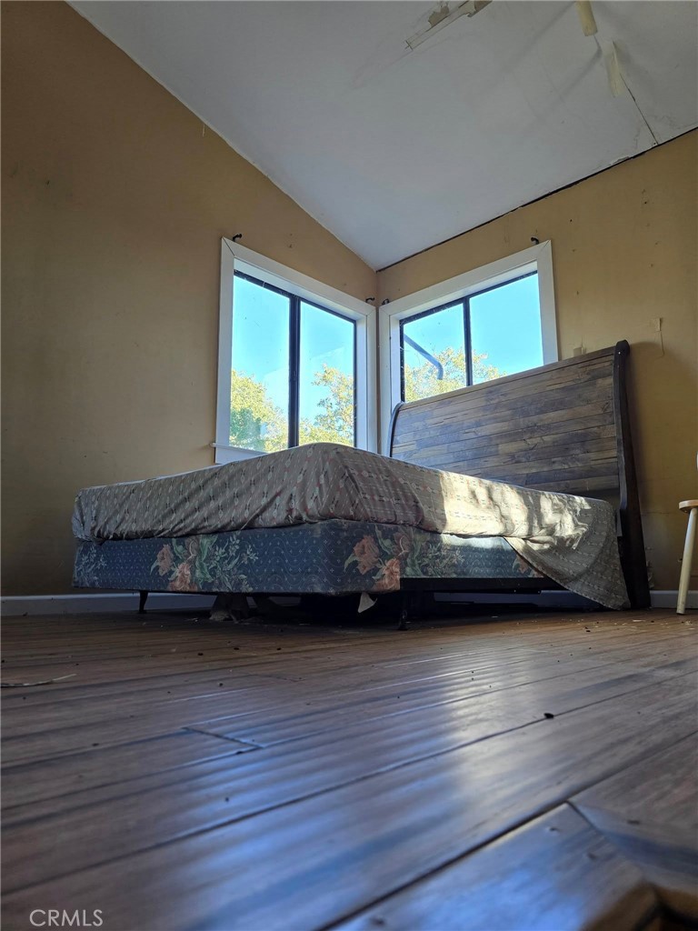 728 Watertrough Road Clearlake Oaks, CA 95423 - Photo 6 of 17 a living room with a bed furniture and a window