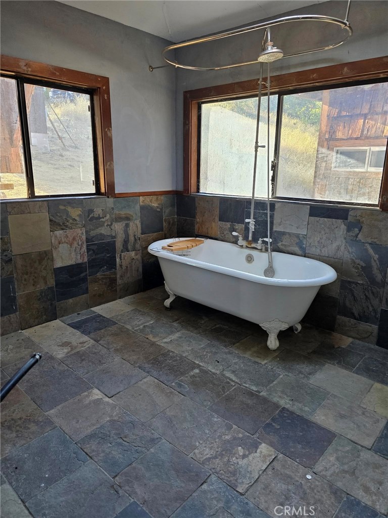 728 Watertrough Road Clearlake Oaks, CA 95423 - Photo 7 of 17 a spacious bathroom with a sink and a mirror