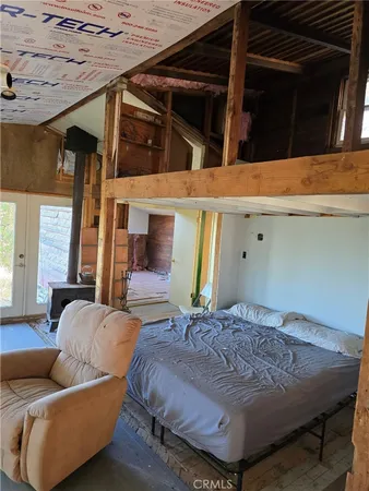 a bed room with a bed and a couch