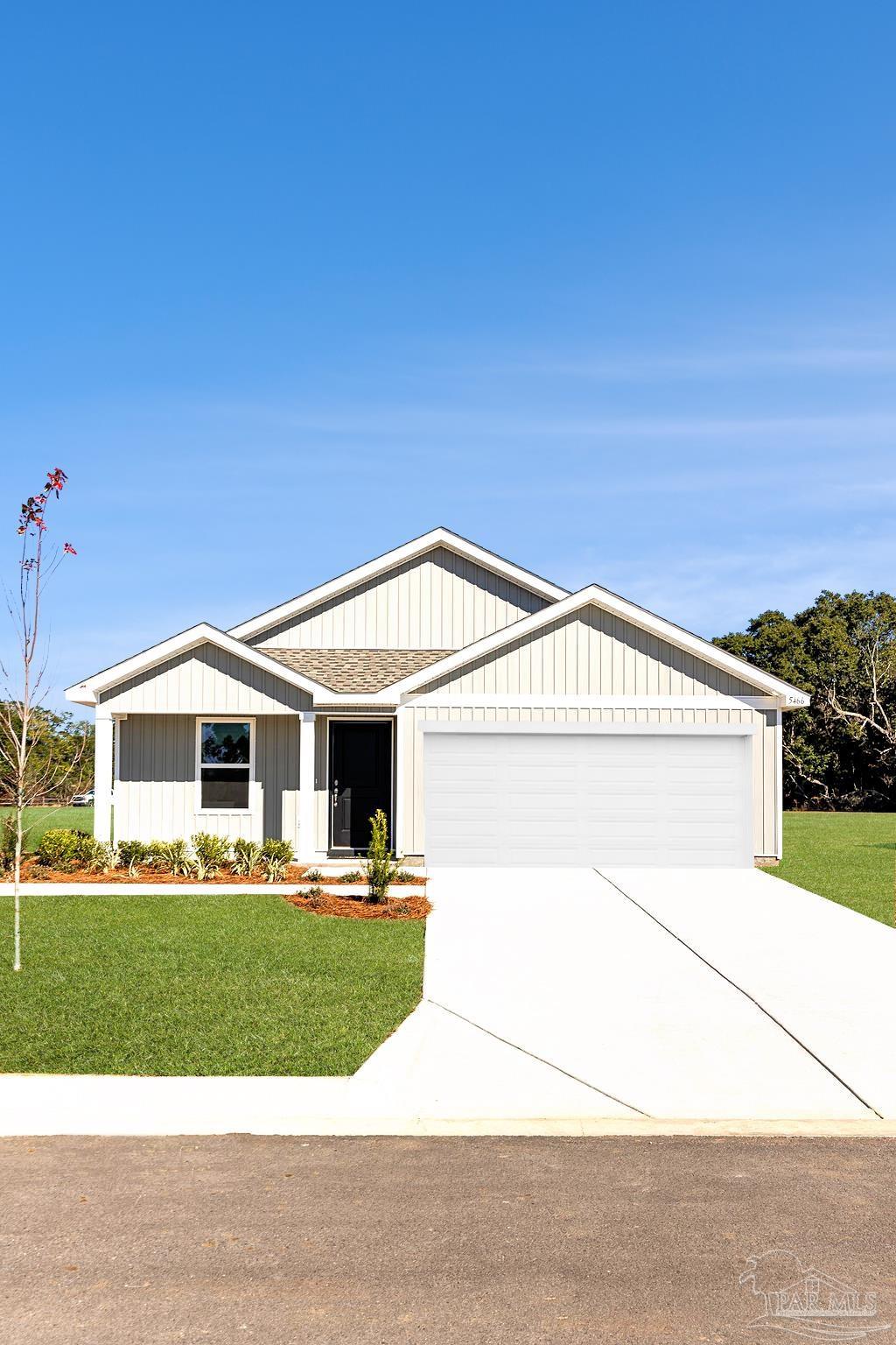 4731 Bald Eagle Road Pace, FL 32571 - Photo 3 of 19 a front view of a house with a yard