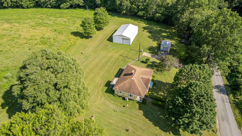 469 Terwilliger Road Parker, PA 16049 - Photo 1 of 47 an aerial view of a house with a yard swimming pool and outdoor seating