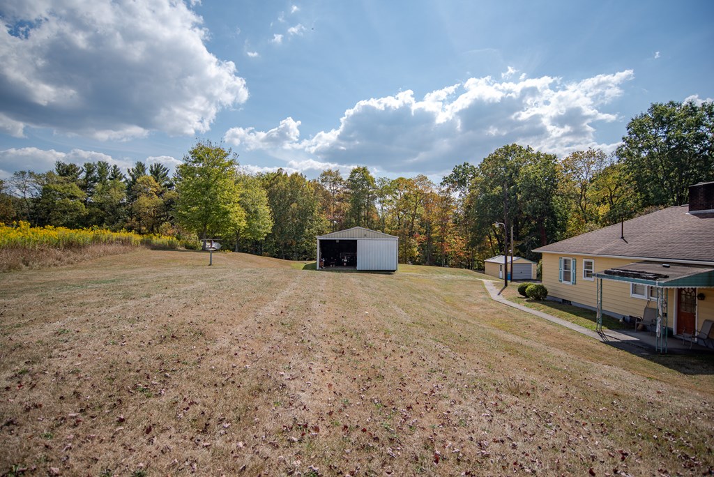 469 Terwilliger Road Parker, PA 16049 - Photo 27 of 47 a view of a house with a yard and sitting area