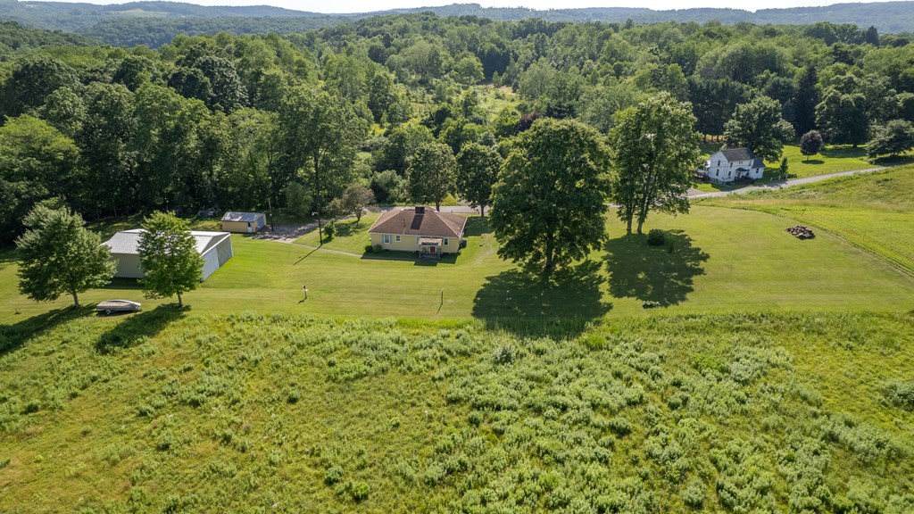 469 Terwilliger Road Parker, PA 16049 - Photo 9 of 47 a view of a garden with an outdoor space