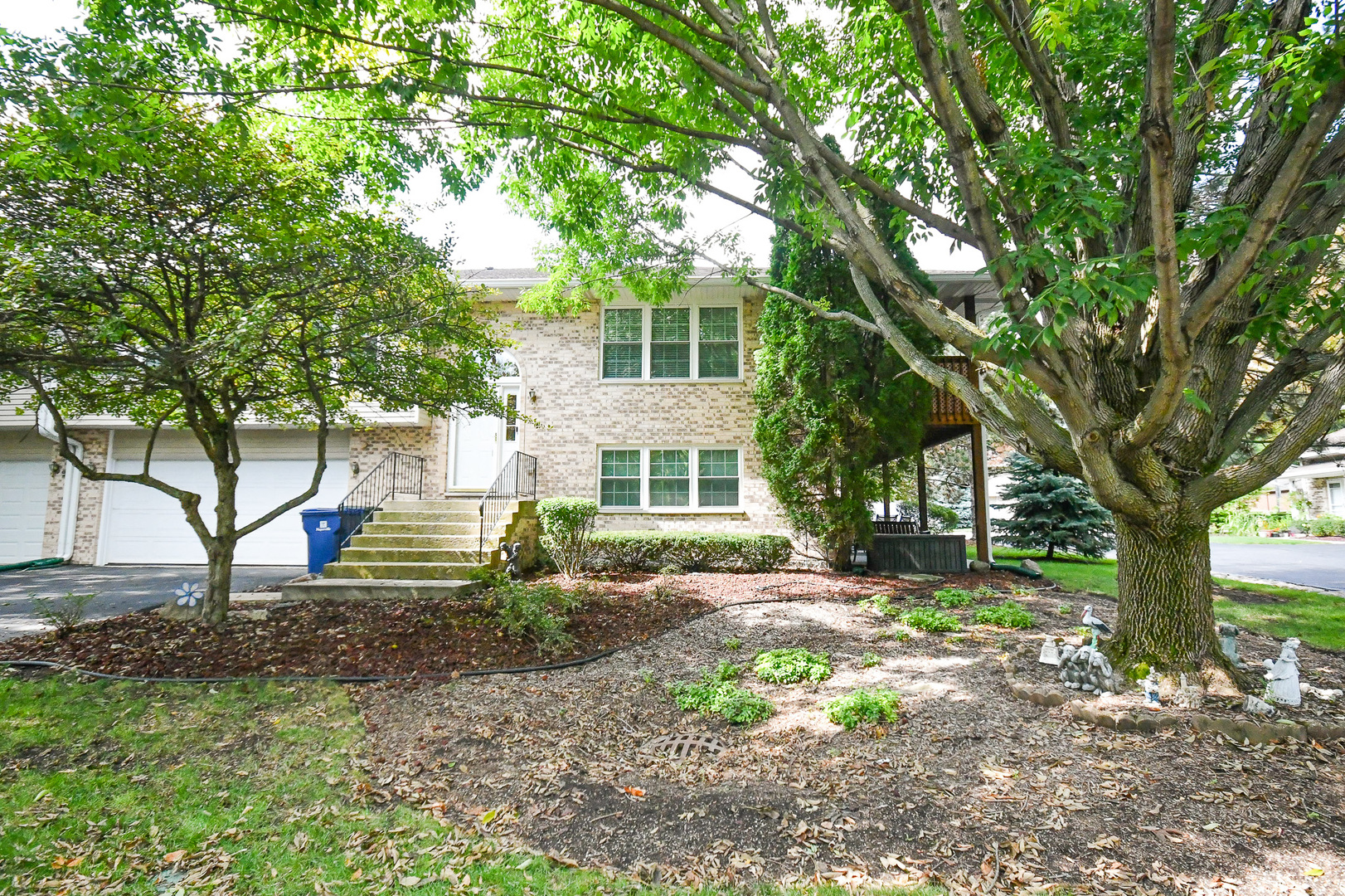 a view of an house with backyard space and garden