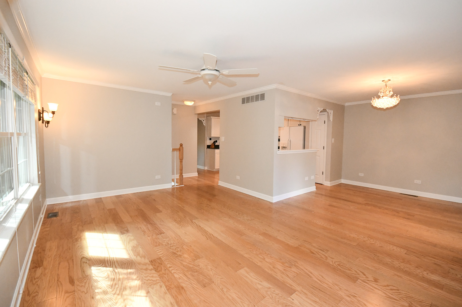 960 Elderberry Circle, Unit 108 Naperville, IL 60563 - Photo 11 of 32 an empty room with wooden floor and windows