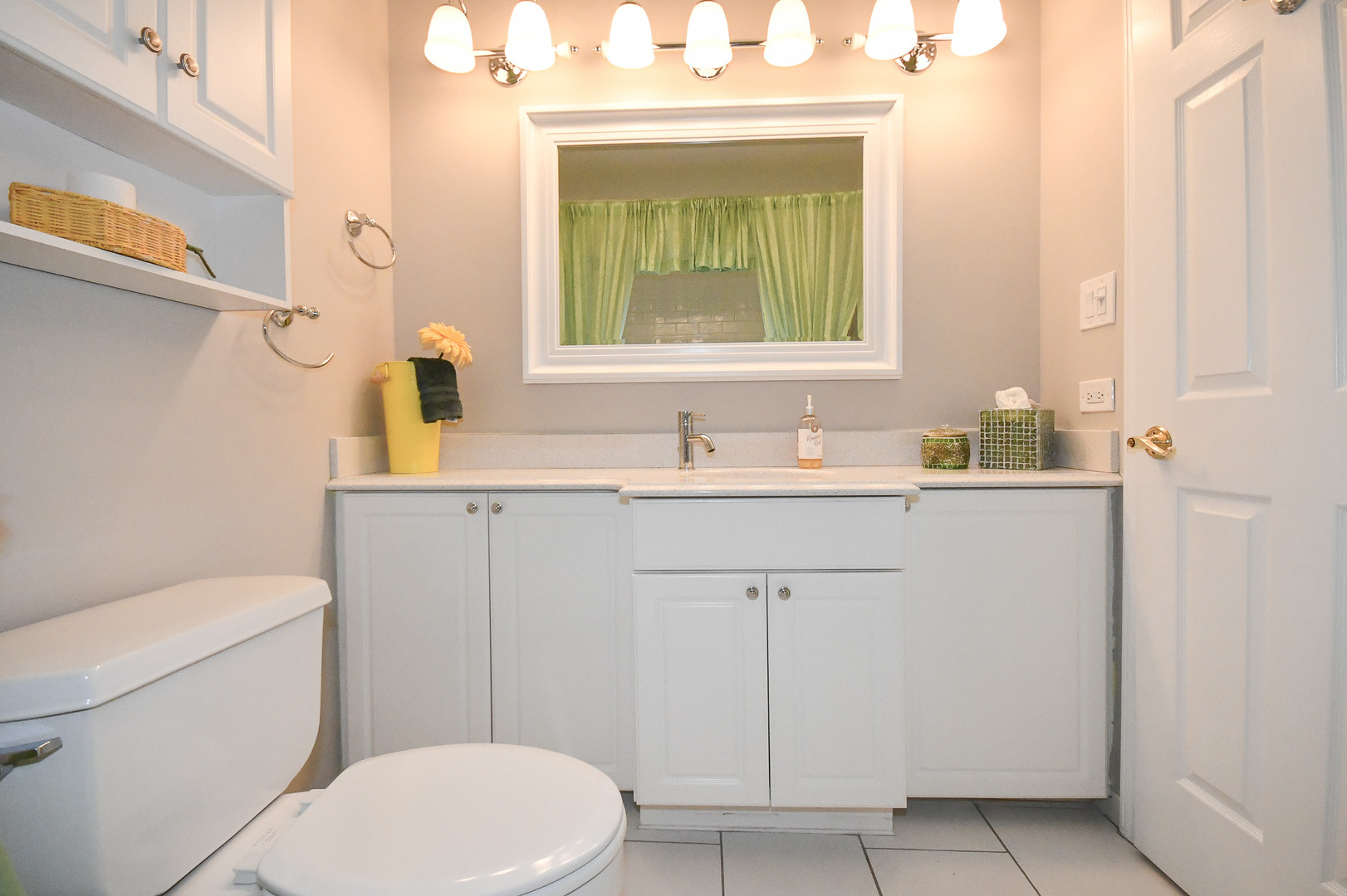 960 Elderberry Circle, Unit 108 Naperville, IL 60563 - Photo 21 of 32 a bathroom with a sink a toilet and mirror