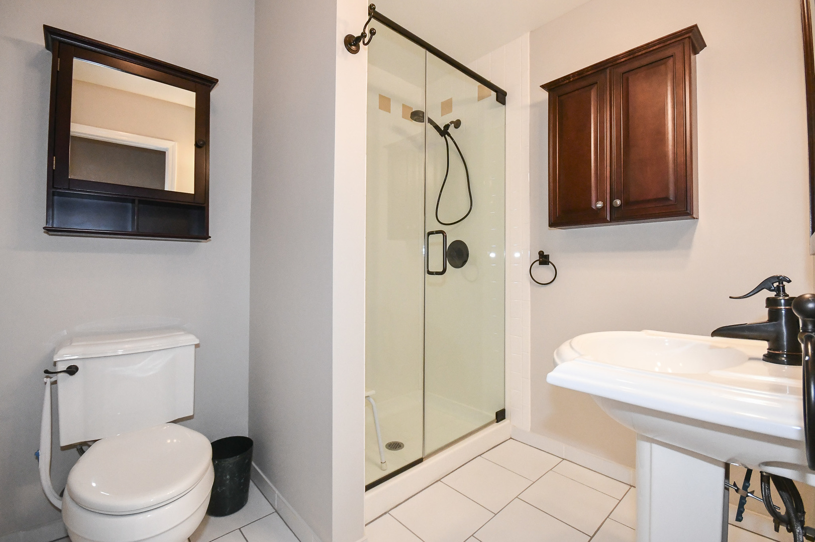 960 Elderberry Circle, Unit 108 Naperville, IL 60563 - Photo 23 of 32 a bathroom with a toilet a sink and shower