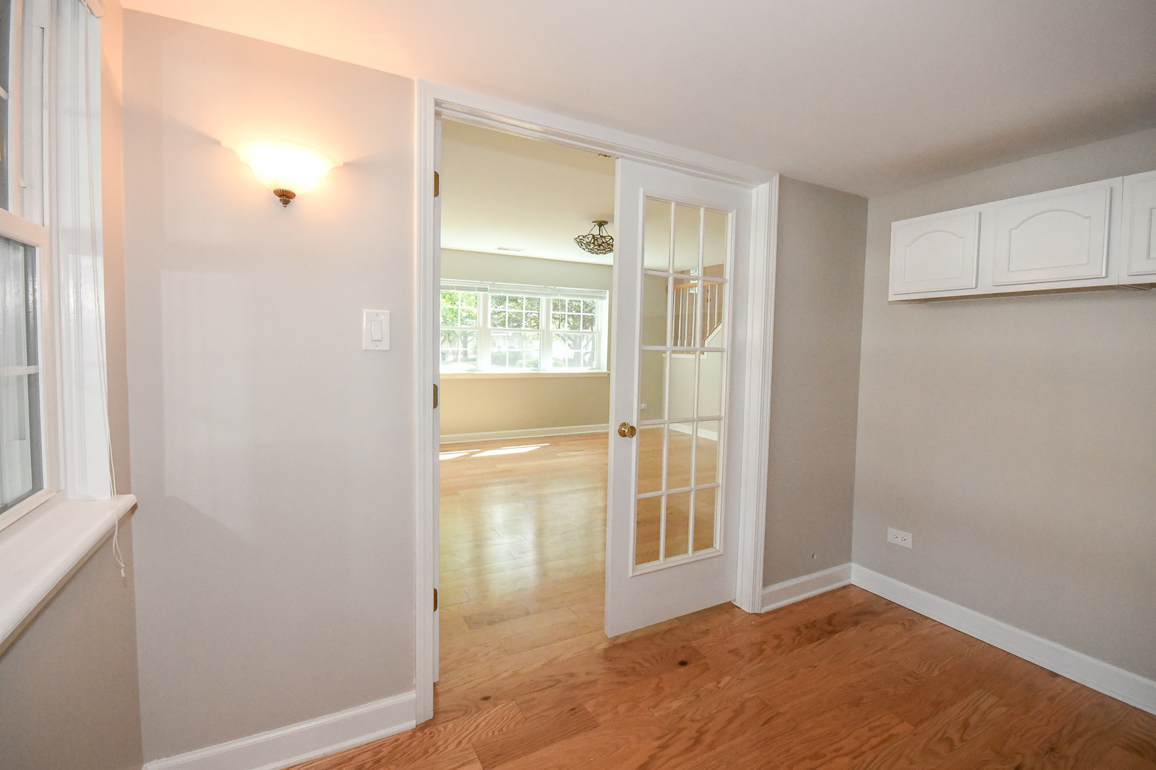 960 Elderberry Circle, Unit 108 Naperville, IL 60563 - Photo 26 of 32 an empty room with cabinet and windows