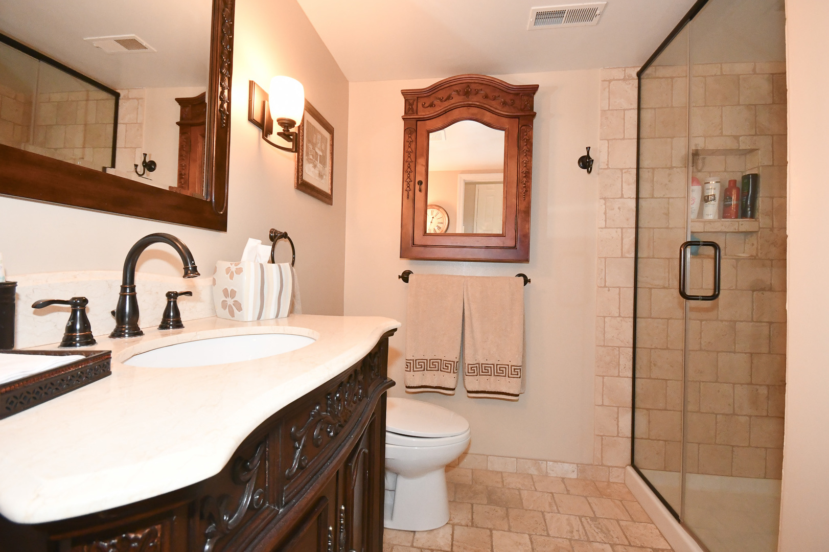 960 Elderberry Circle, Unit 108 Naperville, IL 60563 - Photo 27 of 32 a bathroom with a sink a toilet and shower