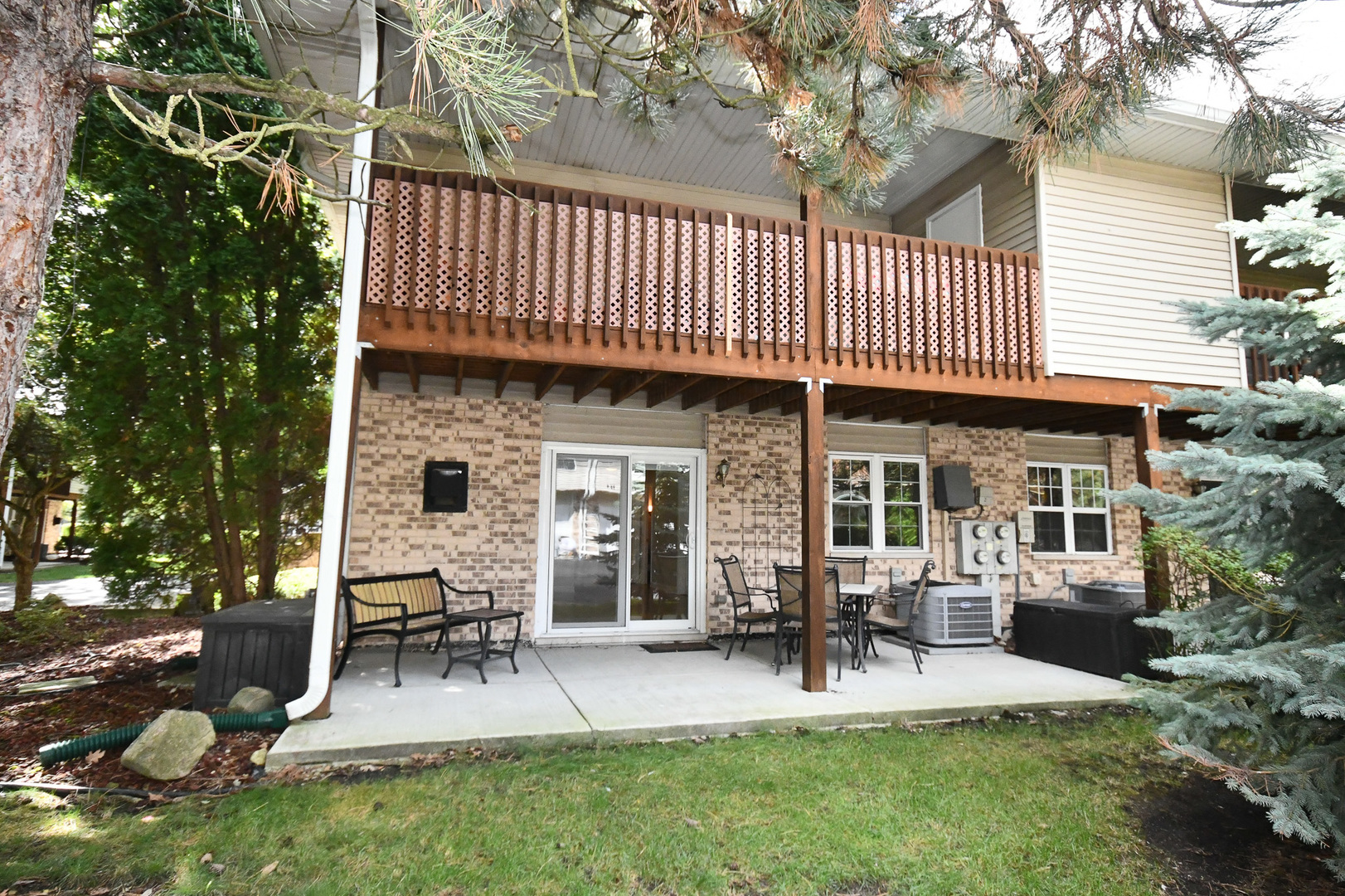 960 Elderberry Circle, Unit 108 Naperville, IL 60563 - Photo 30 of 32 a view of a house with patio and a garden
