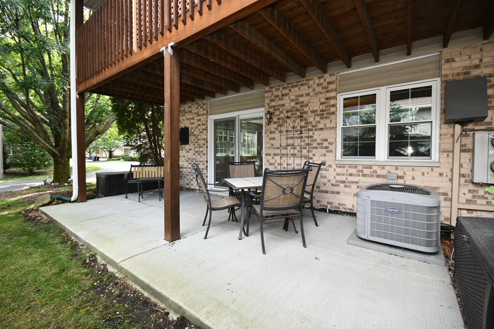 960 Elderberry Circle, Unit 108 Naperville, IL 60563 - Photo 31 of 32 a view of a patio with table and chairs and potted plants