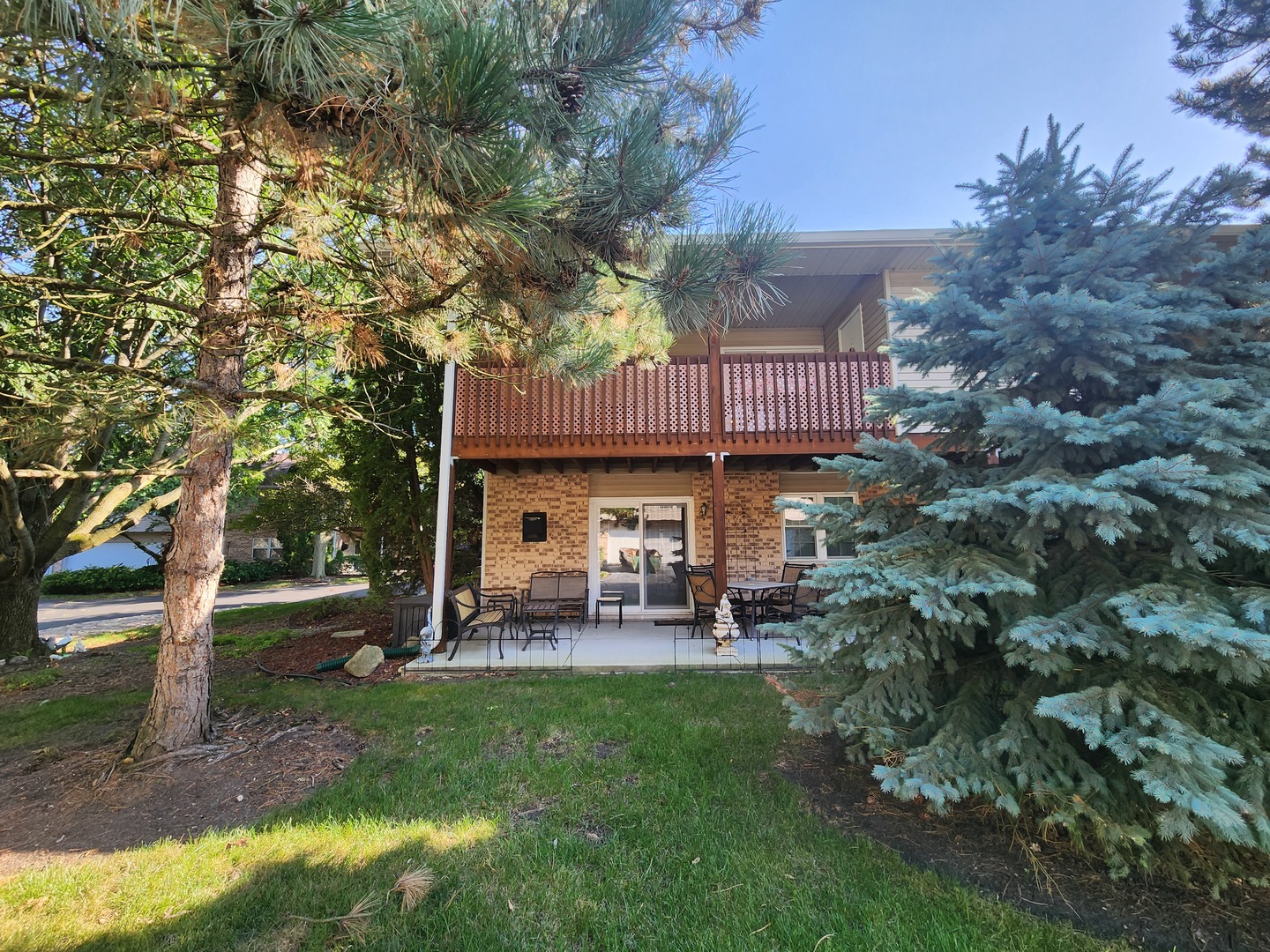 960 Elderberry Circle, Unit 108 Naperville, IL 60563 - Photo 32 of 32 a view of a house with a yard and sitting area