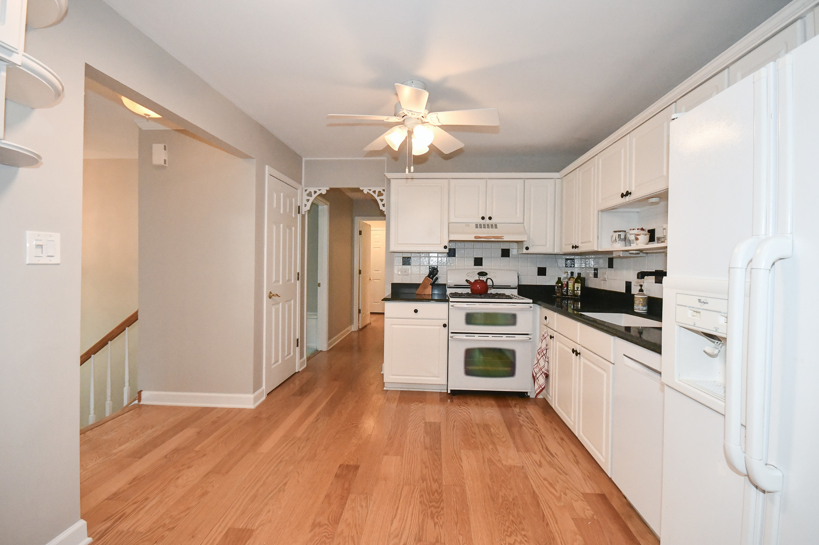 960 Elderberry Circle, Unit 108 Naperville, IL 60563 - Photo 4 of 32 a kitchen with white cabinets and stainless steel appliances
